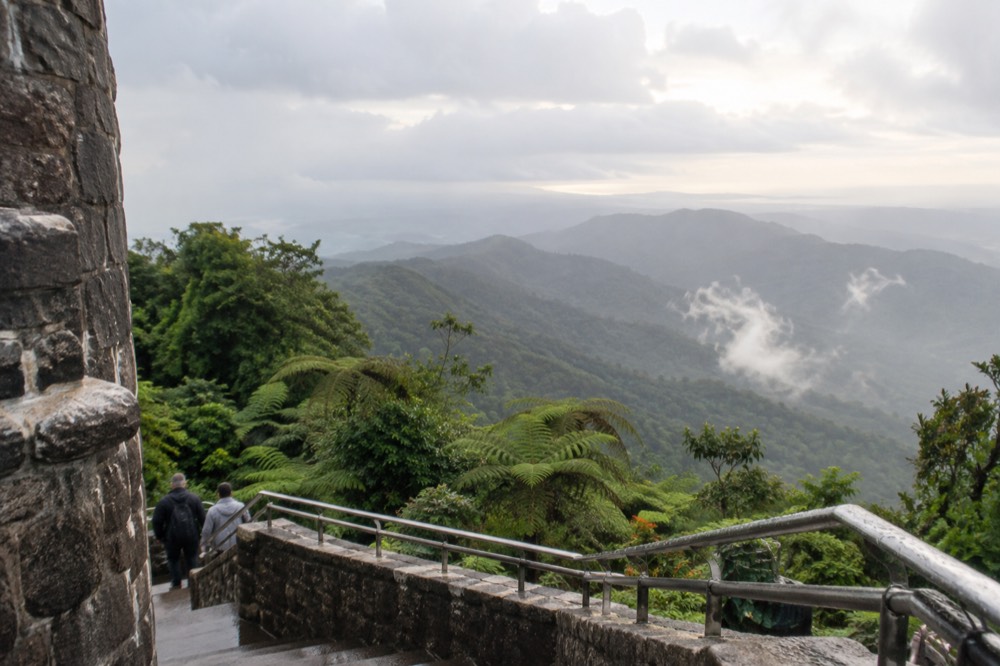 Rainforest valley with layered green ridges fading into mist